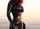 Superb redhead in latex suit