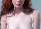 Cute redhead exposing her small but sexy tits