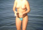 Cutie going topless in the waves